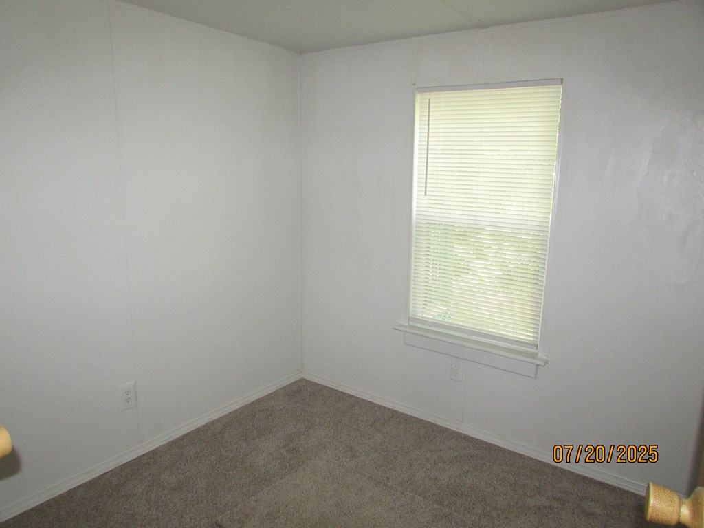 1444 Abe Cove Road Hiawassee, GA 30546 - Photo 12 of 25 an empty room with a window