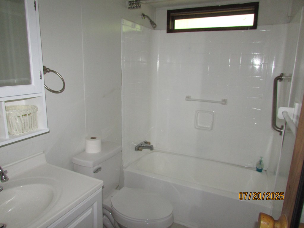 1444 Abe Cove Road Hiawassee, GA 30546 - Photo 14 of 25 a bathroom with a sink a toilet and shower