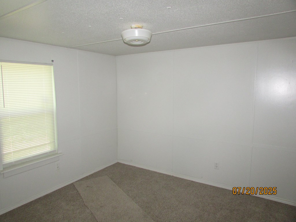 1444 Abe Cove Road Hiawassee, GA 30546 - Photo 17 of 25 an empty room with a empty space and a window