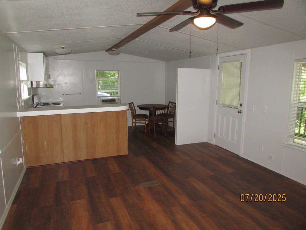 1444 Abe Cove Road Hiawassee, GA 30546 - Photo 19 of 25 a living room with wooden floor and a window