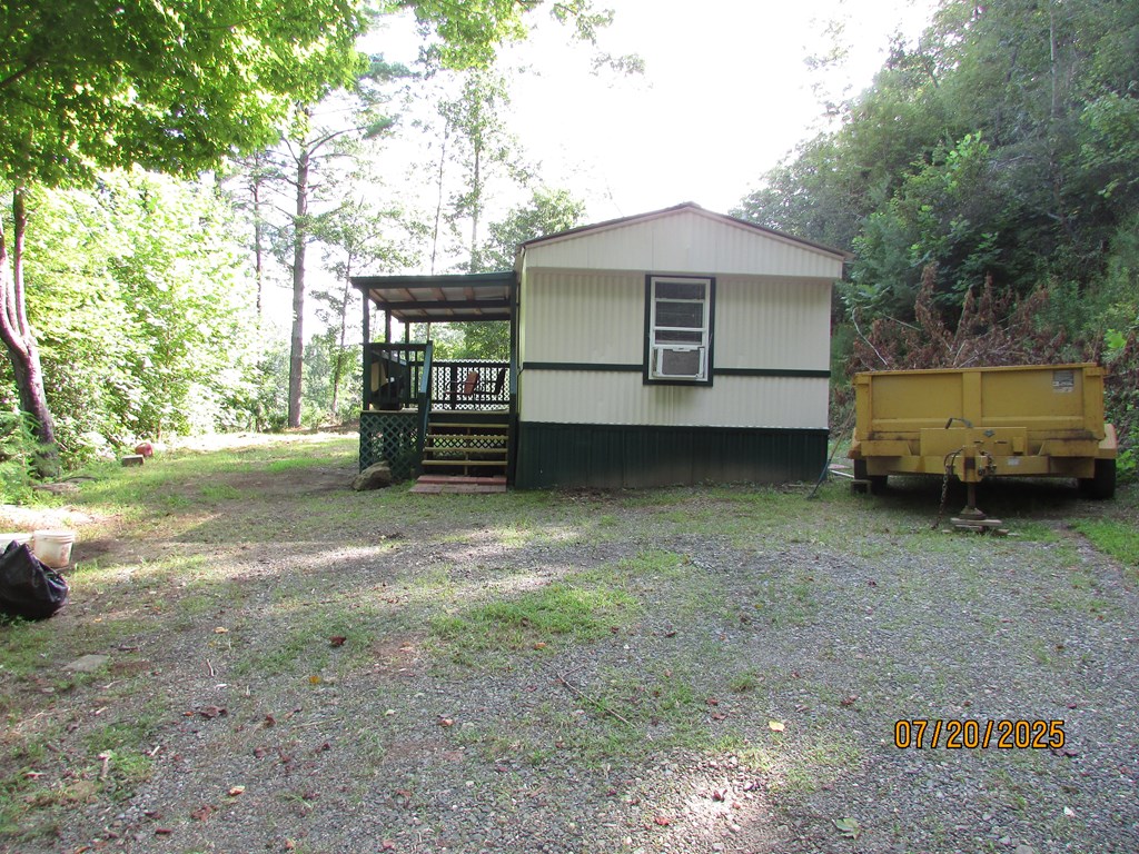 1444 Abe Cove Road Hiawassee, GA 30546 - Photo 21 of 25 a view of a house with a yard