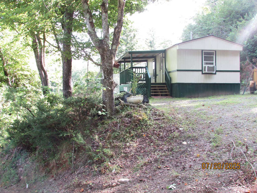 1444 Abe Cove Road Hiawassee, GA 30546 - Photo 25 of 25 a view of a house with a yard