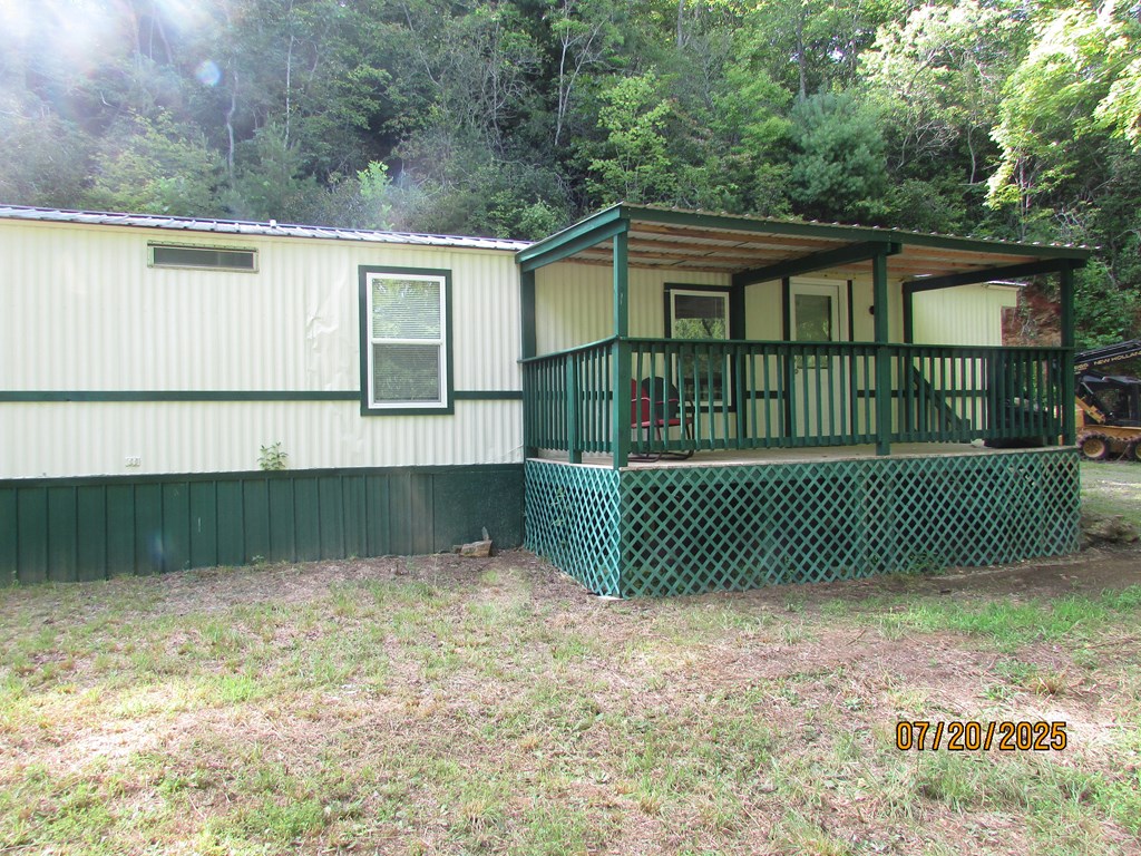1444 Abe Cove Road Hiawassee, GA 30546 - Photo 6 of 25 a view of a house with a yard