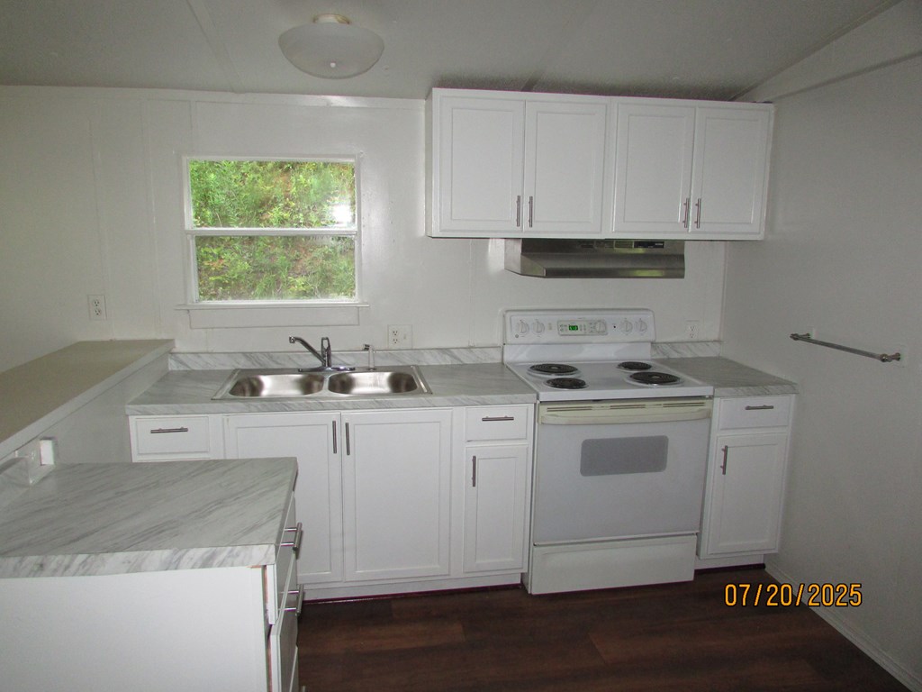 1444 Abe Cove Road Hiawassee, GA 30546 - Photo 10 of 25 a kitchen with appliances cabinets and a sink