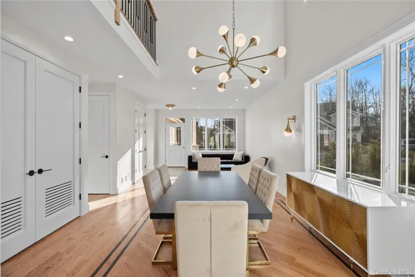 a view of a dining room with furniture window and wooden floor