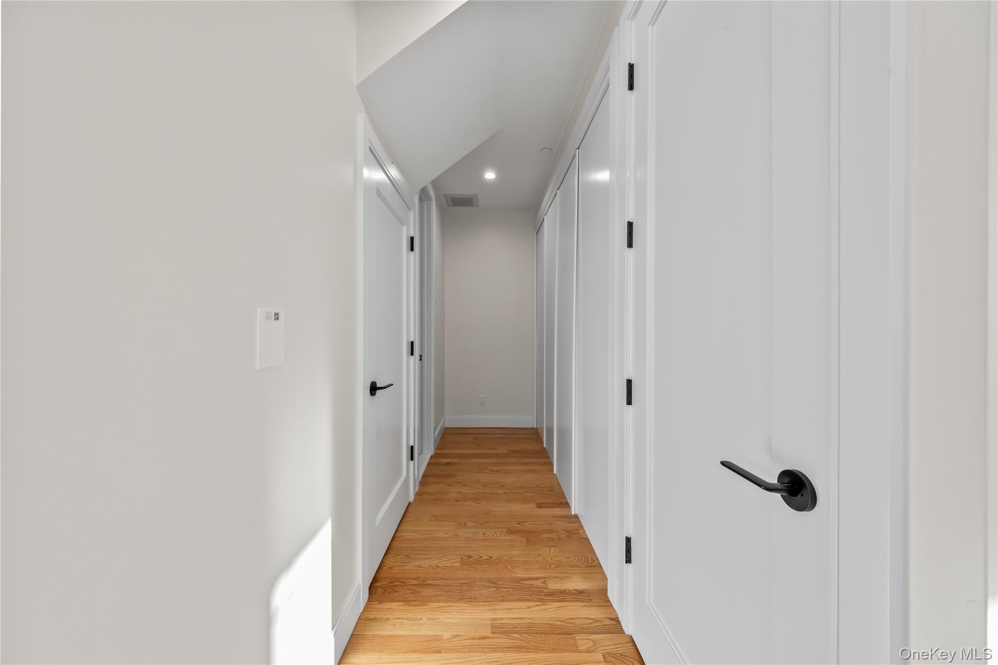 59 Dessau Circle Spring Valley, NY 10977 - Photo 24 of 48 a view of a hallway with wooden floor and a bathroom