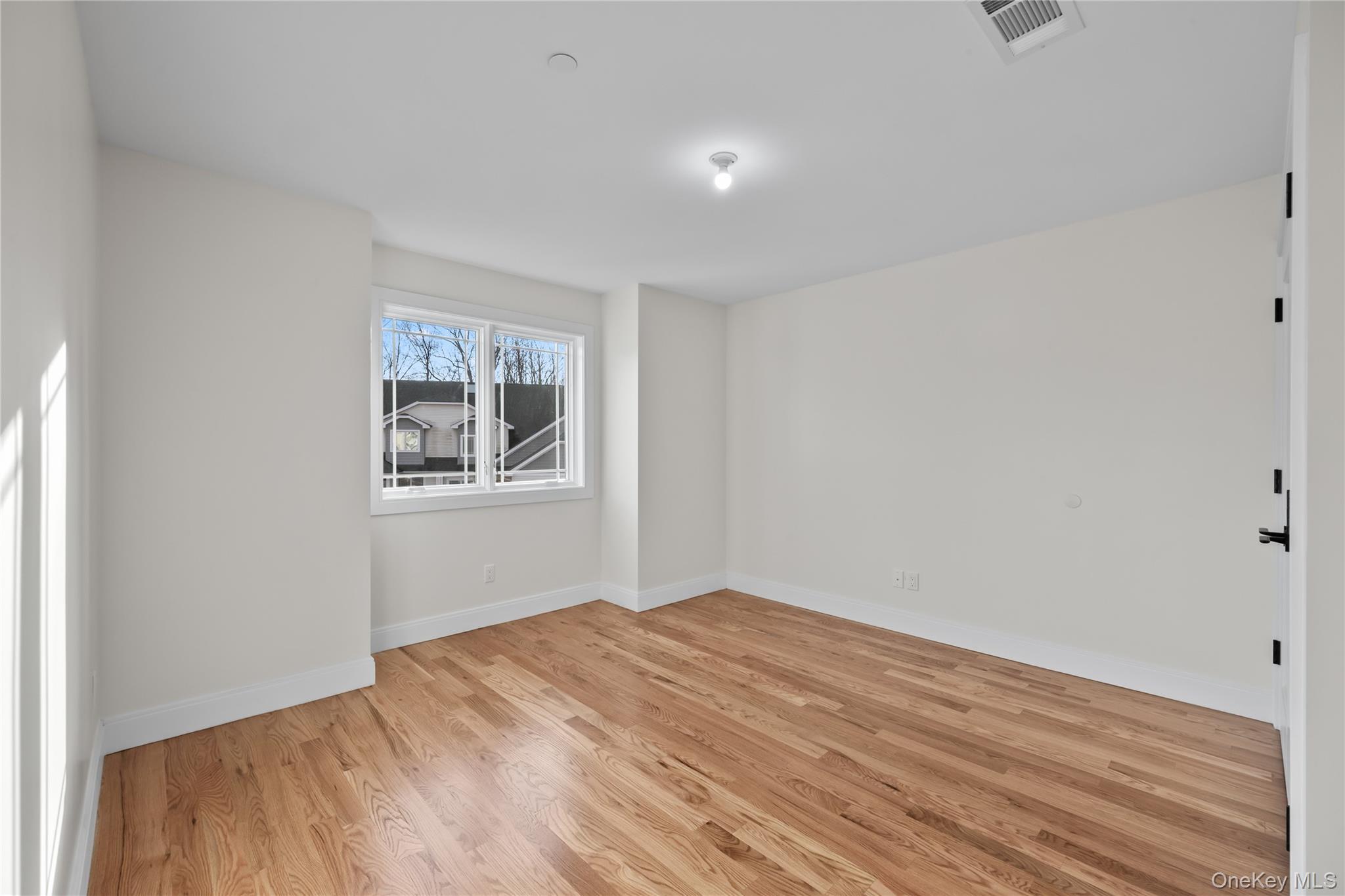 59 Dessau Circle Spring Valley, NY 10977 - Photo 34 of 48 a view of empty room with wooden floor and fan