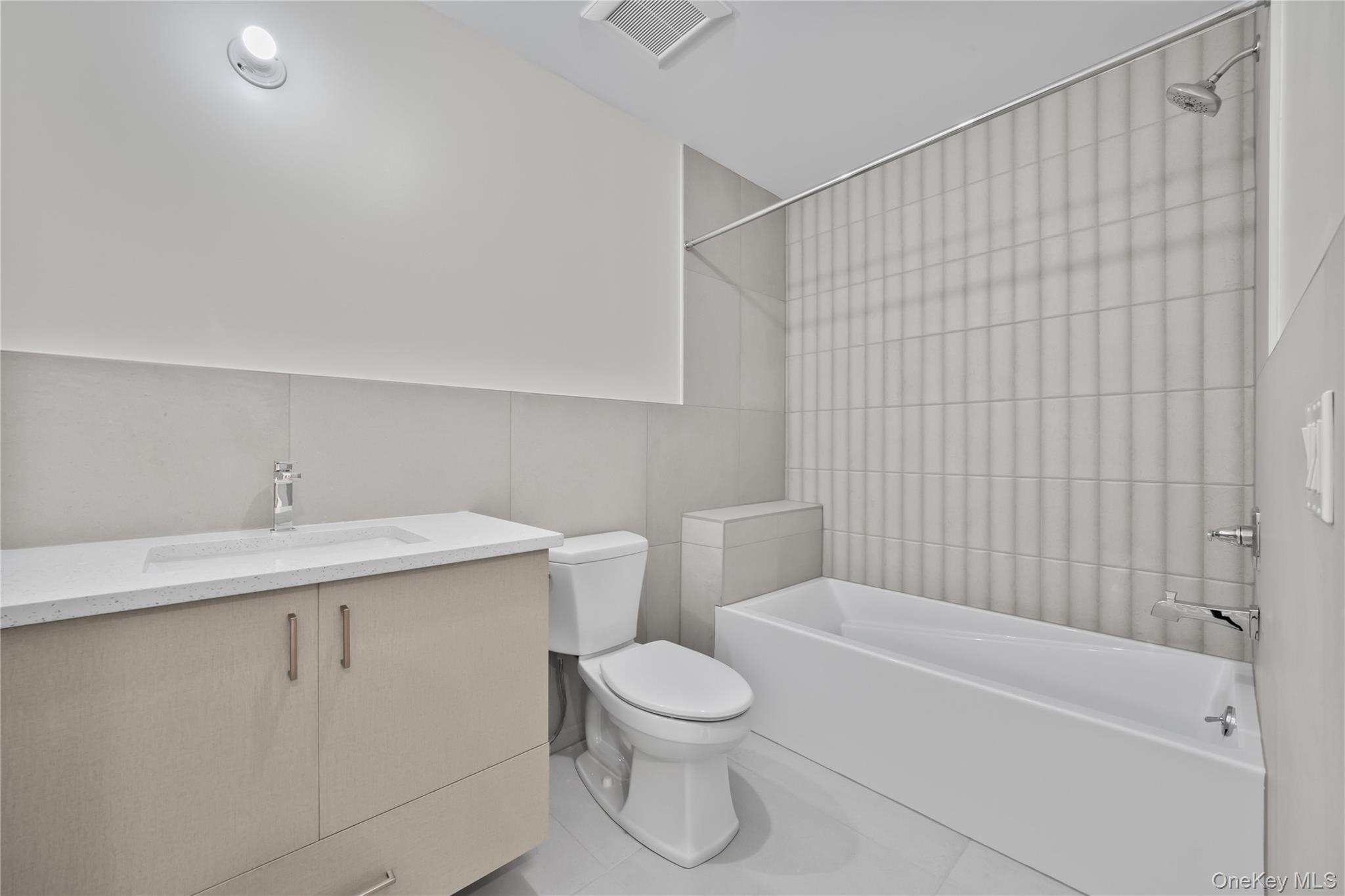 59 Dessau Circle Spring Valley, NY 10977 - Photo 39 of 48 a bathroom with a toilet sink vanity tub and shower