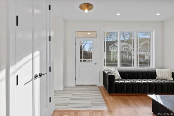 a living room with a couch and a large window