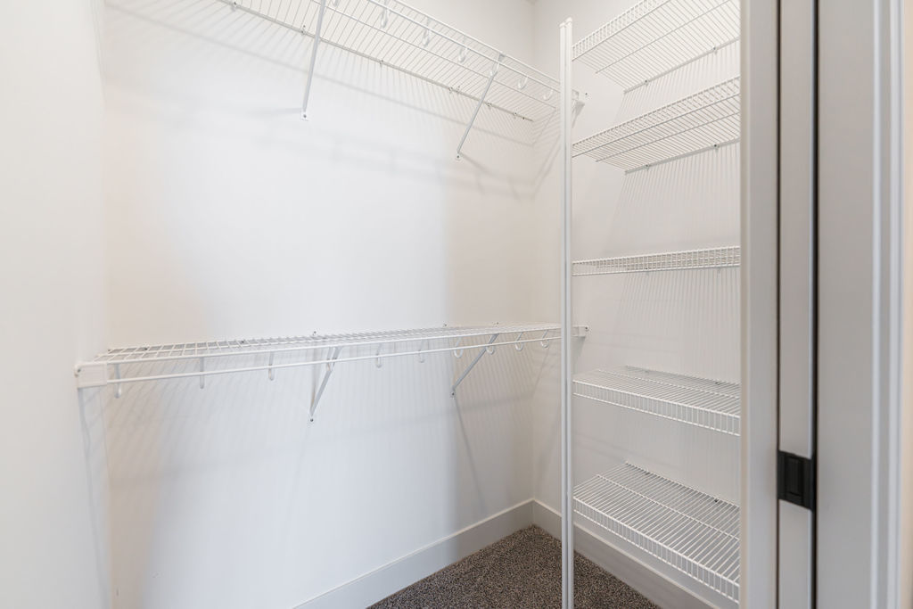 46 Kloe Lane, Unit 46 Sycamore, IL 60178 - Photo 30 of 54 a view of a room with racks on the wall
