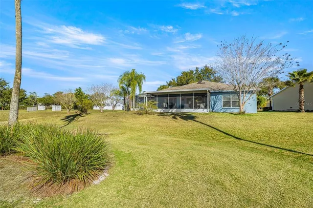a view of a swimming pool with a table and chairs