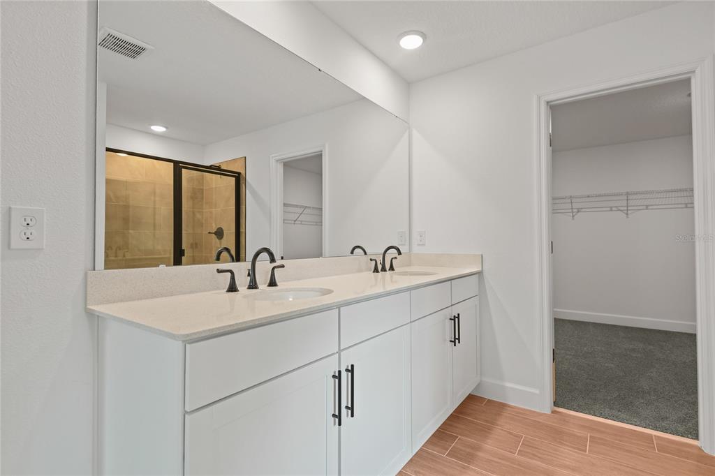 1026 Cloud Rdg Court Mount Dora, FL 32757 - Photo 14 of 20 a bathroom with a sink and a mirror