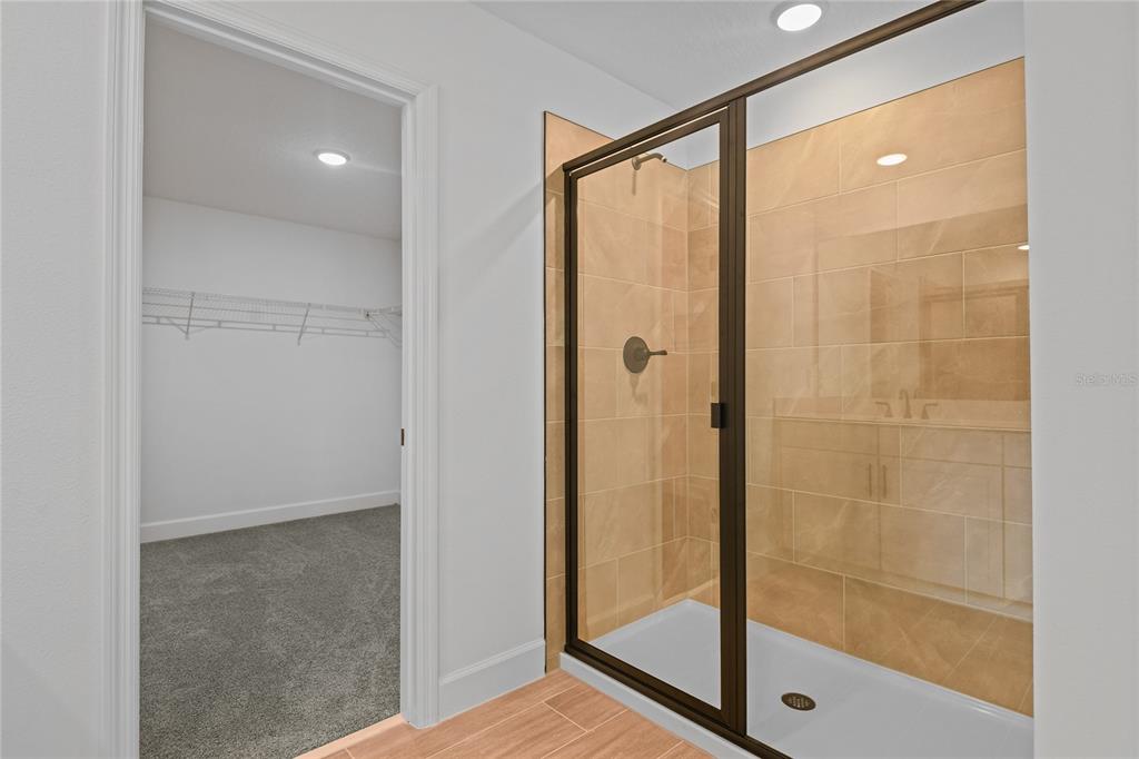 1026 Cloud Rdg Court Mount Dora, FL 32757 - Photo 15 of 20 a bathroom with a glass shower door