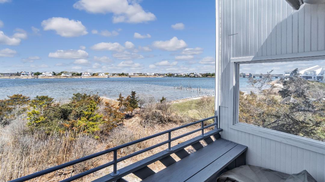 a view of a lake from a balcony