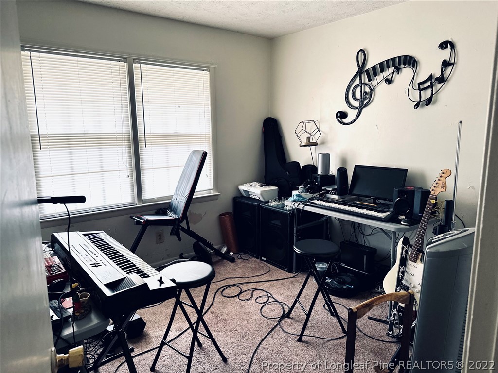 7405 Southgate Road Fayetteville, NC 28314 - Photo 11 of 16 a work room with furniture and window