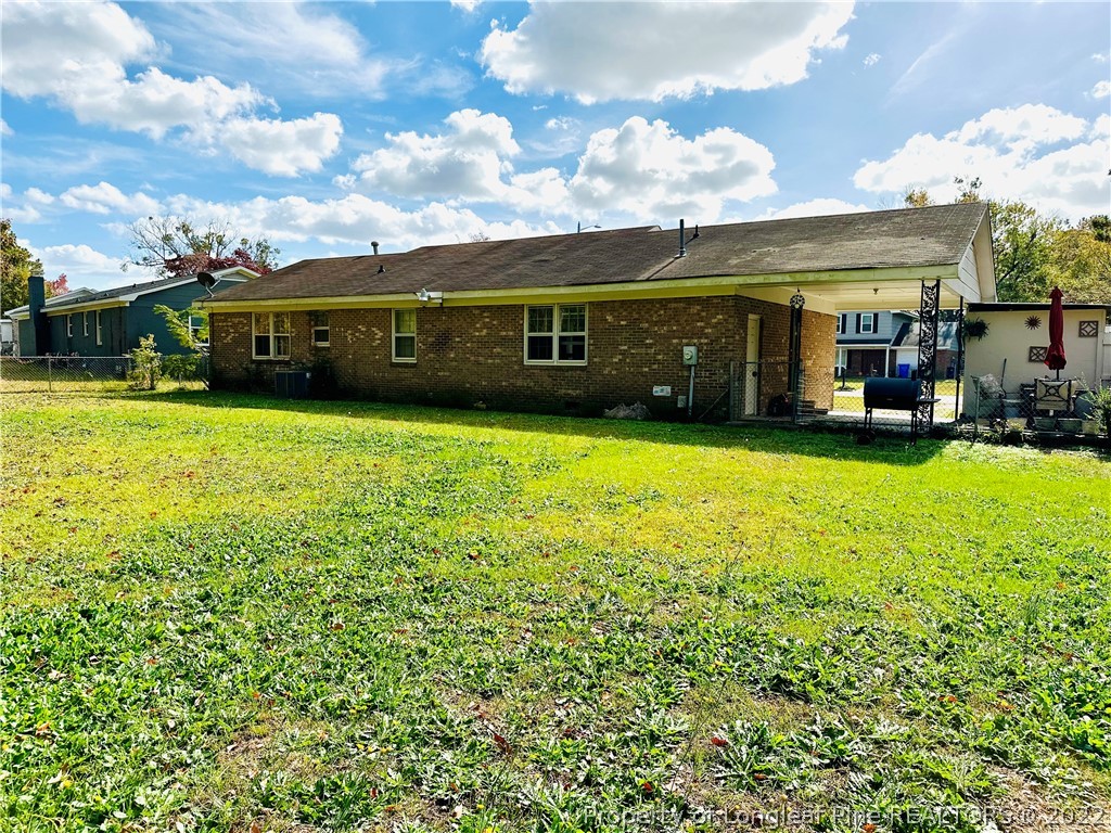 7405 Southgate Road Fayetteville, NC 28314 - Photo 2 of 16 a view of a house with a garden