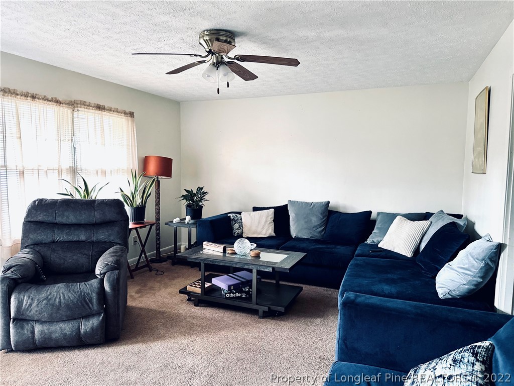 7405 Southgate Road Fayetteville, NC 28314 - Photo 3 of 16 a living room with furniture and a window