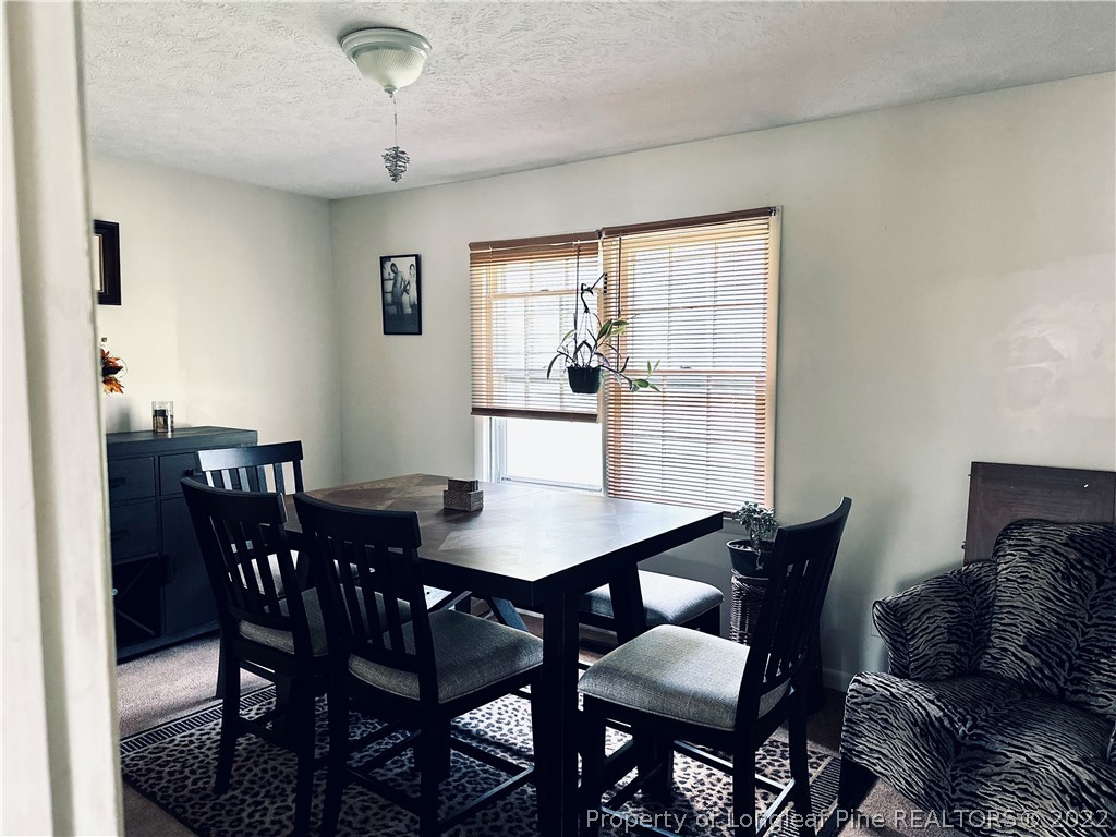 7405 Southgate Road Fayetteville, NC 28314 - Photo 4 of 16 a view of a dining room with furniture and window