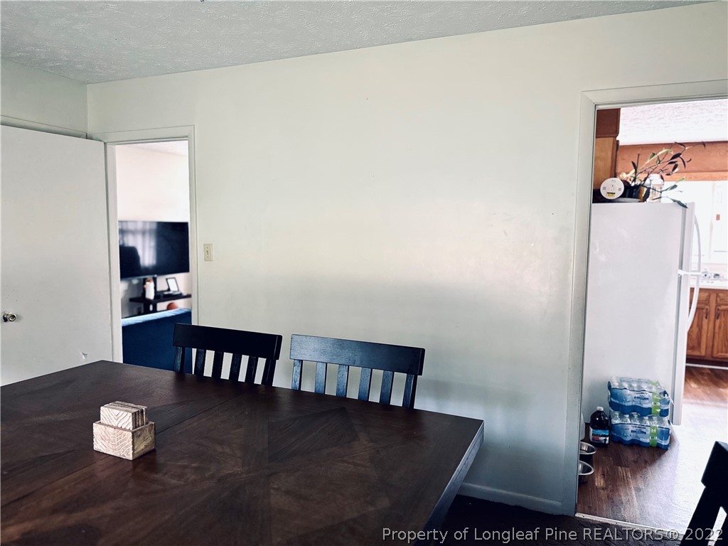 7405 Southgate Road Fayetteville, NC 28314 - Photo 8 of 16 a view of a dining room with furniture