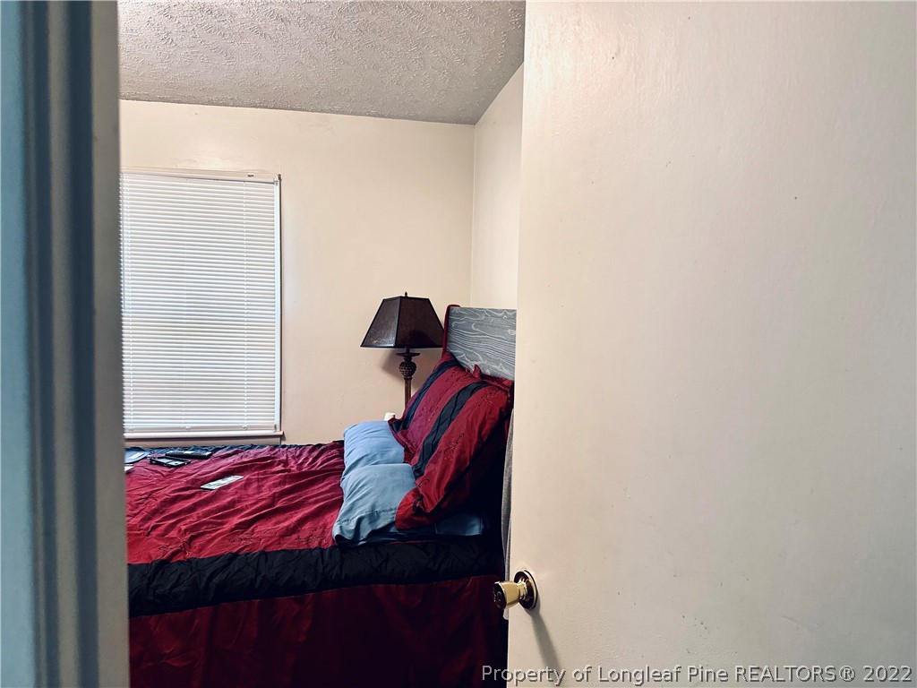 7405 Southgate Road Fayetteville, NC 28314 - Photo 9 of 16 a view of hallway that has a couch in it