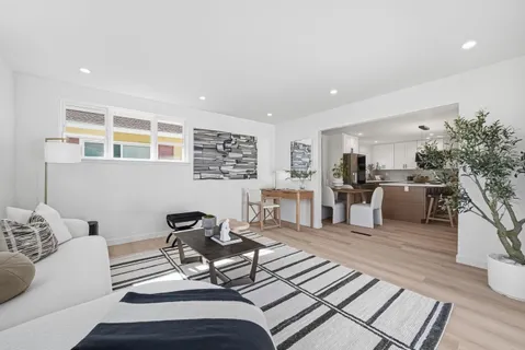 a living room with furniture and a table
