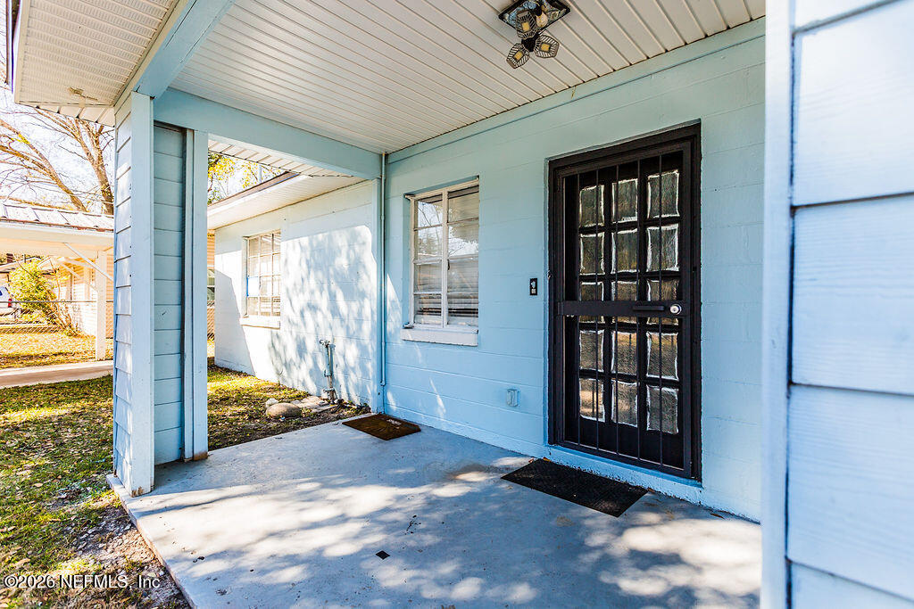 2533 Orchard Street Jacksonville, FL 32254 - Photo 3 of 13 a view of a livingroom with a floor to ceiling window and wooden floor