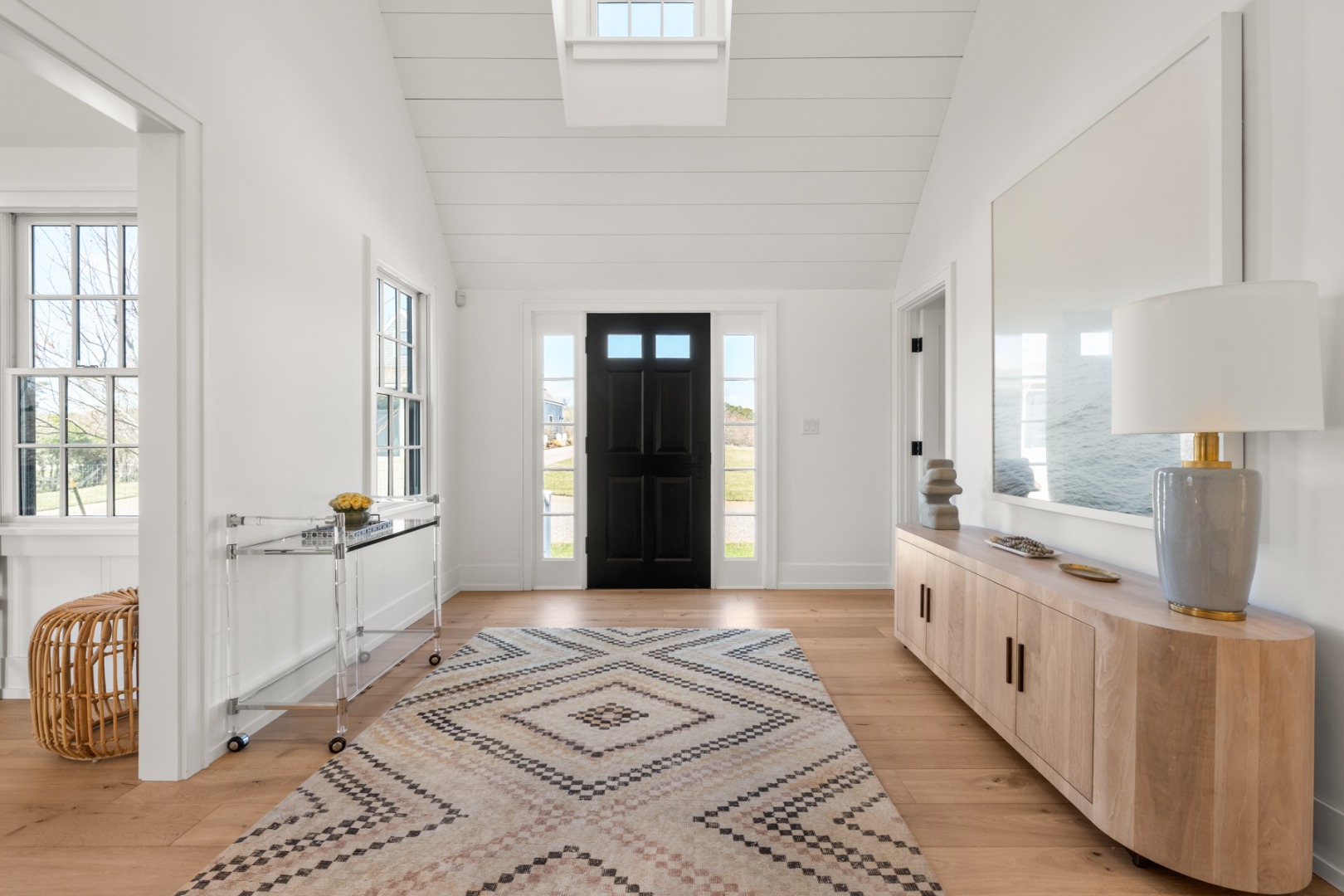 174 Cliff Road Nantucket, MA 02554 - Photo 4 of 49 a view of a bedroom with wooden floor and windows