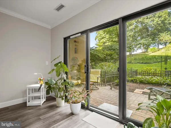 a room with garden view and a potted plant