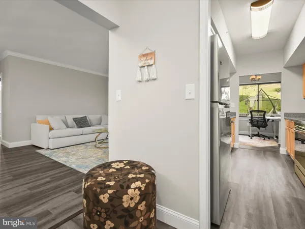 a bedroom with wooden floor and a bed