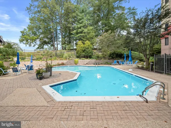 a view of a swimming pool with a patio