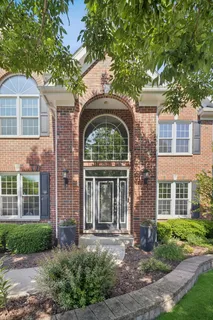 front view of a house with a garden