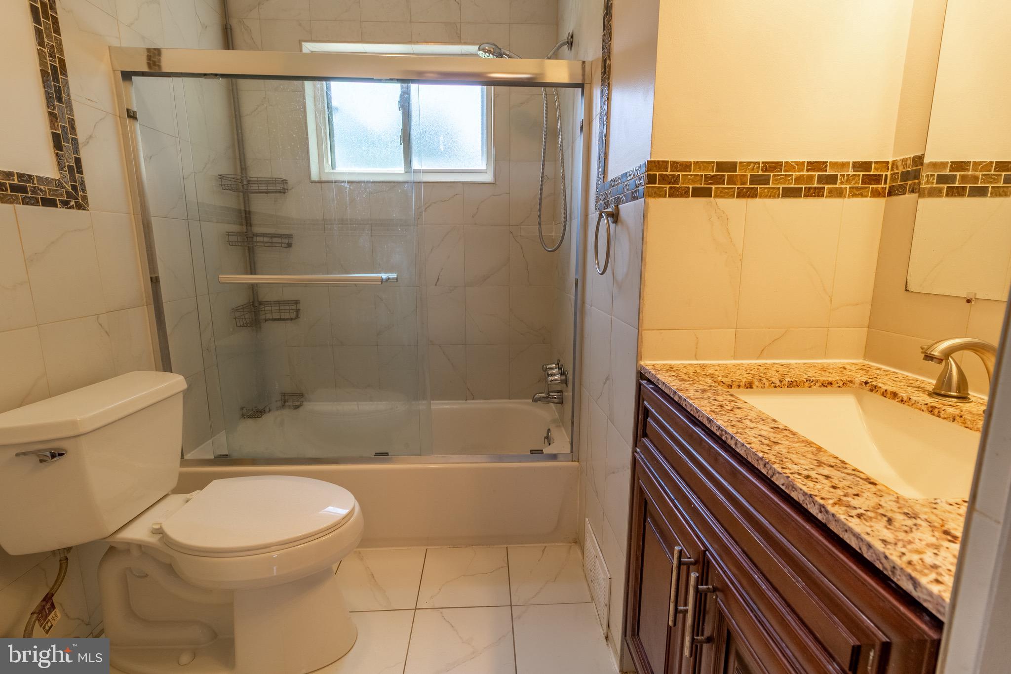 1545 Shoemaker Road Abington, PA 19001 - Photo 11 of 32 a bathroom with a granite countertop bathtub toilet and sink