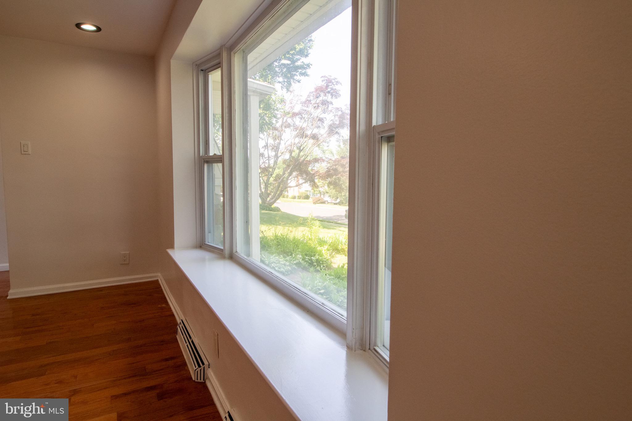 1545 Shoemaker Road Abington, PA 19001 - Photo 19 of 32 a view of a room with wooden floor and windows