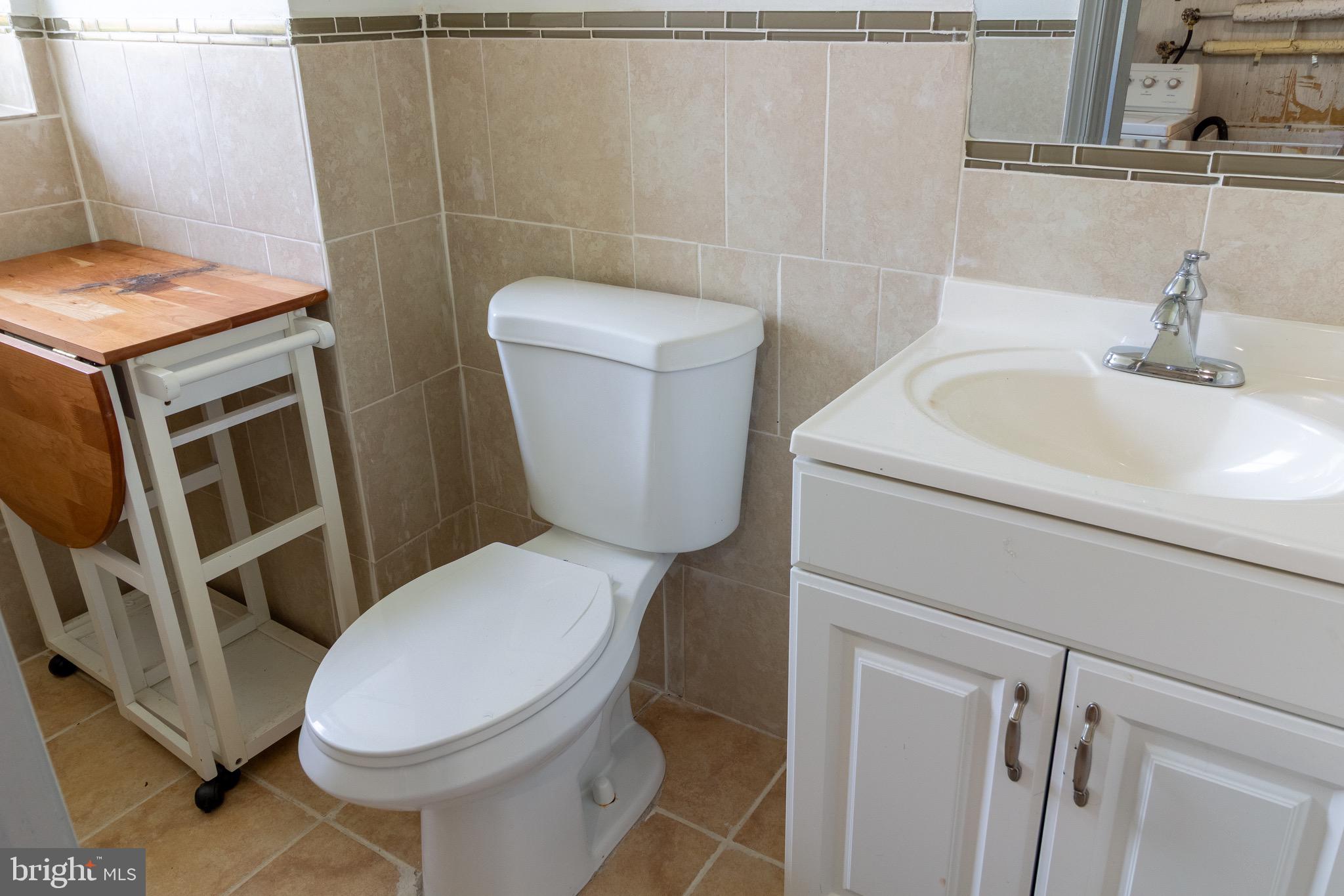 1545 Shoemaker Road Abington, PA 19001 - Photo 26 of 32 a white toilet sitting next to a bathroom sink