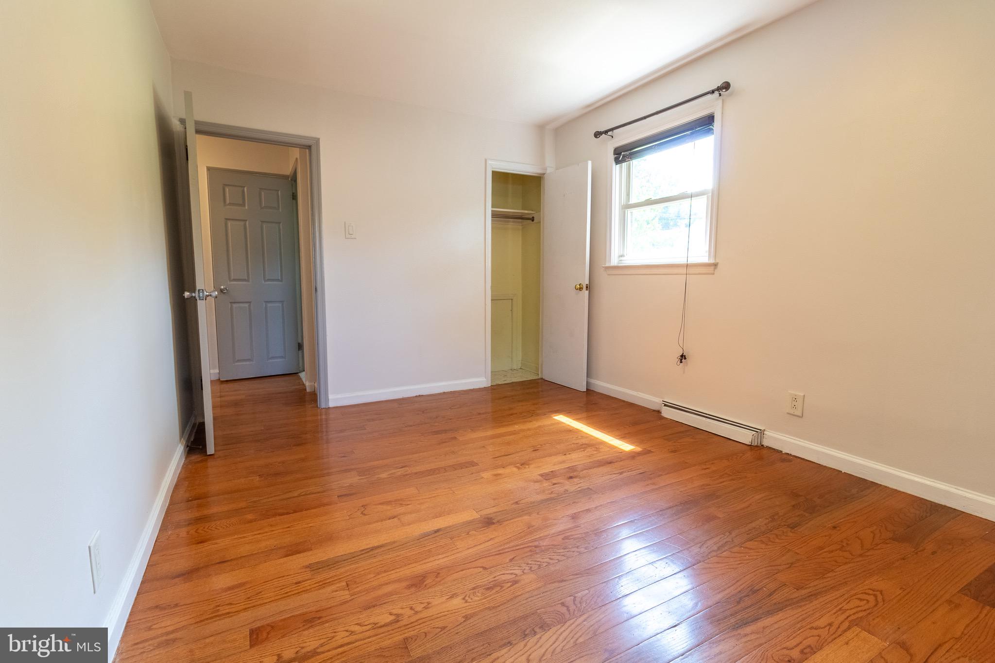 1545 Shoemaker Road Abington, PA 19001 - Photo 9 of 32 a view of an empty room with wooden floor and a window
