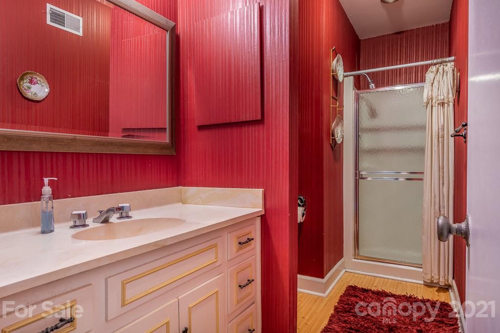 4401 Rounding Run Road Charlotte, NC 28277 - Photo 22 of 31 a bathroom with a sink and a mirror
