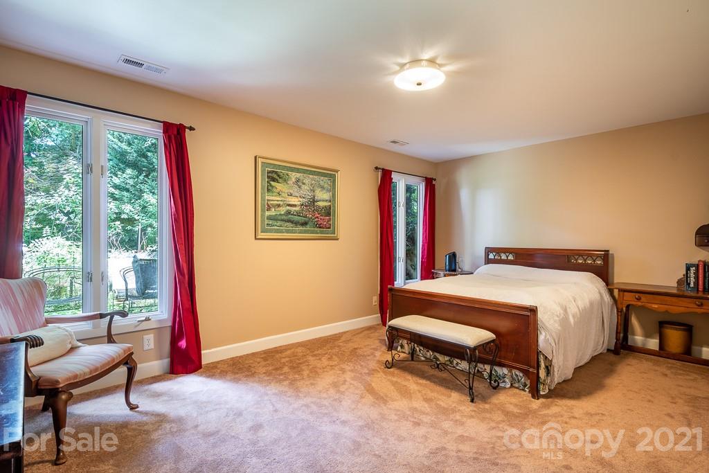 4401 Rounding Run Road Charlotte, NC 28277 - Photo 23 of 31 a spacious bedroom with a bed and a large window