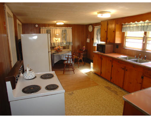 2417 New Sherborn Road Athol, MA 01331 - Photo 5 of 6 a kitchen with a sink and chairs