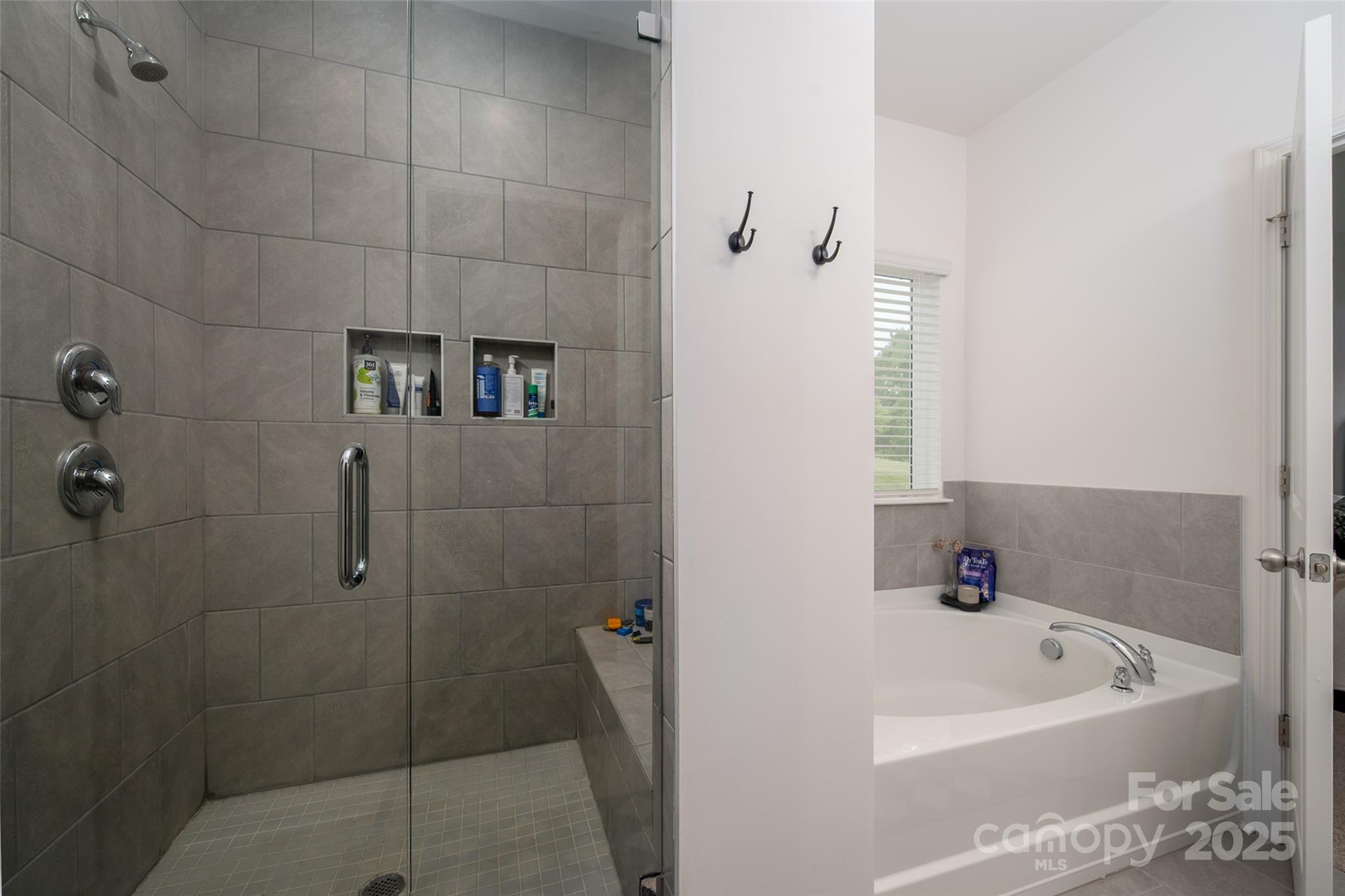 1024 Scotch Meadows Loop, Unit 32 Monroe, NC 28110 - Photo 11 of 19 a bathroom with a bathtub