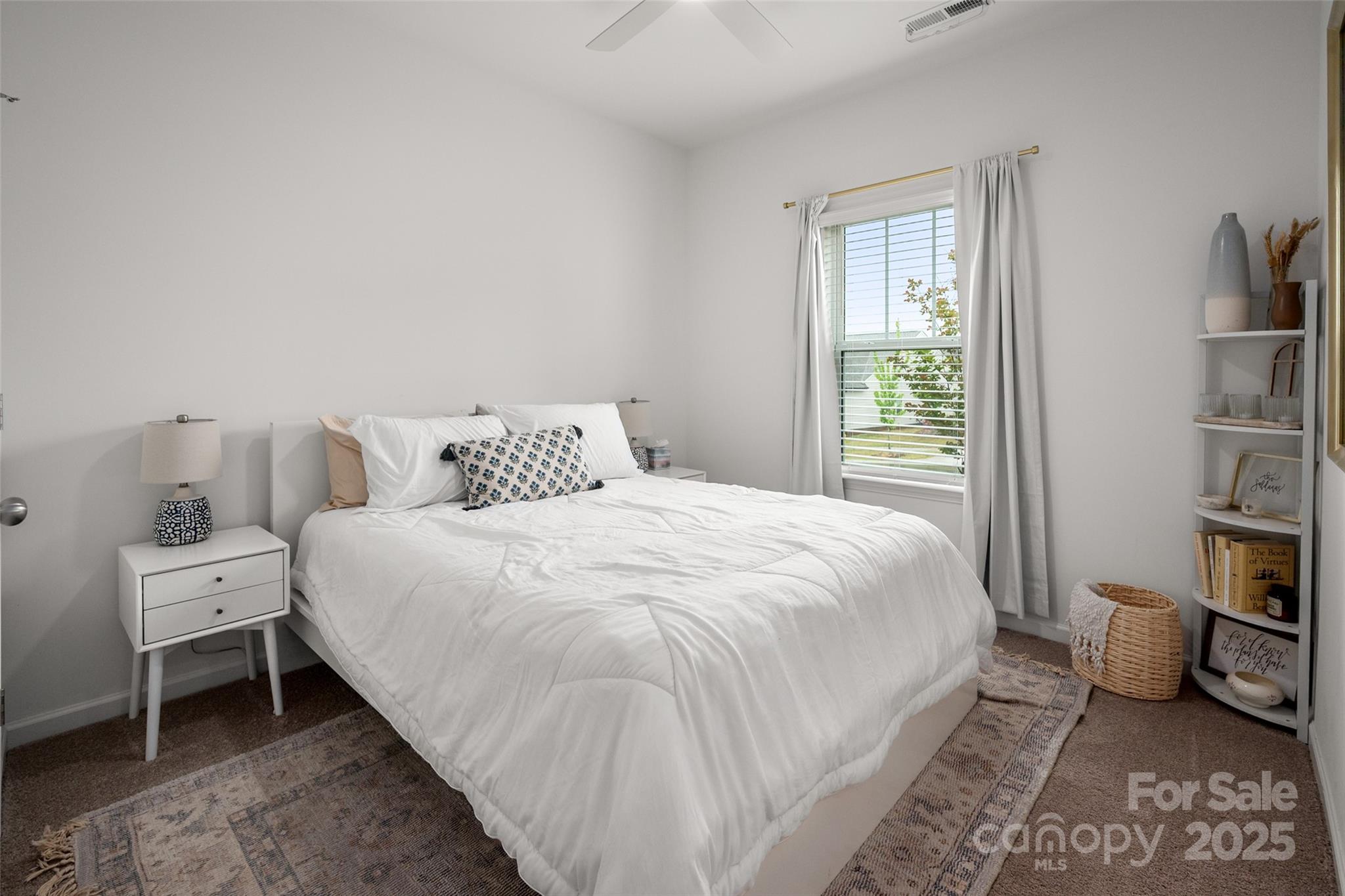 1024 Scotch Meadows Loop, Unit 32 Monroe, NC 28110 - Photo 13 of 19 a bedroom with a bed and a window