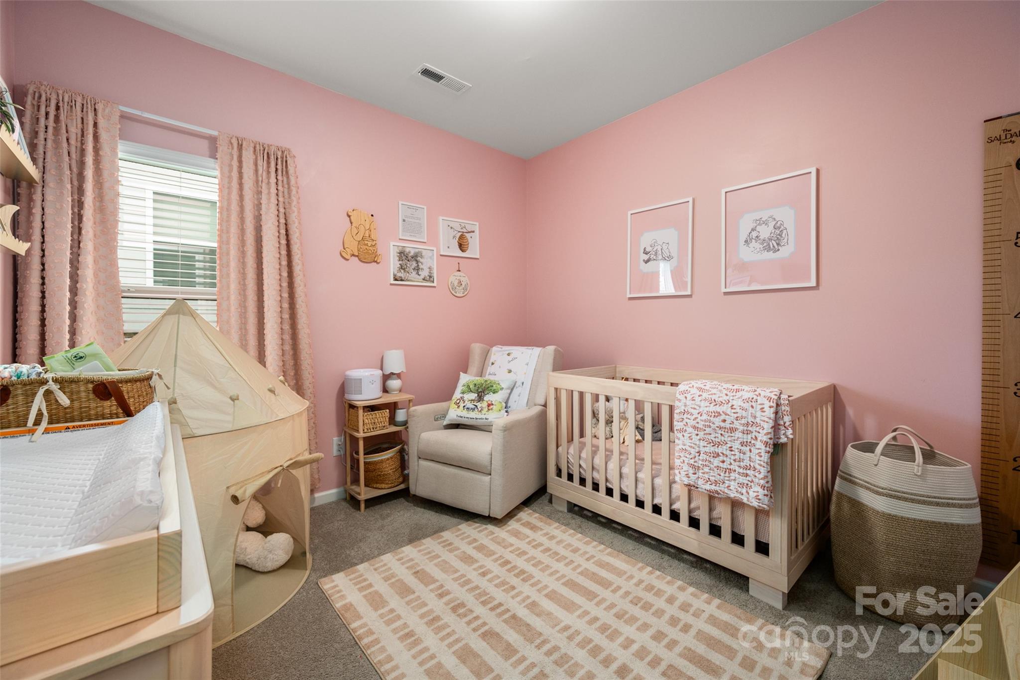 1024 Scotch Meadows Loop, Unit 32 Monroe, NC 28110 - Photo 14 of 19 a living room with furniture and a baby crib