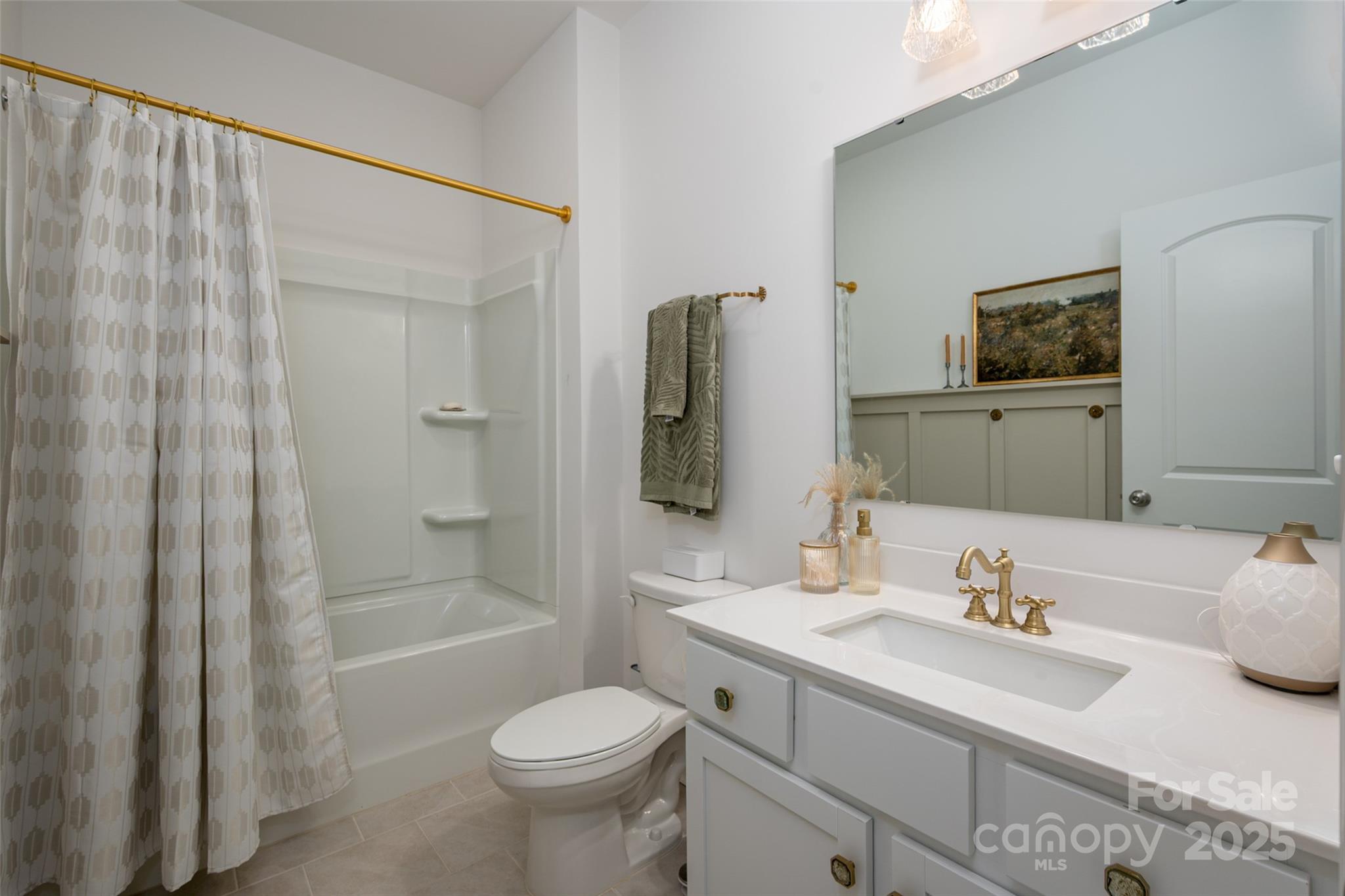 1024 Scotch Meadows Loop, Unit 32 Monroe, NC 28110 - Photo 15 of 19 a bathroom with a granite countertop sink toilet and shower