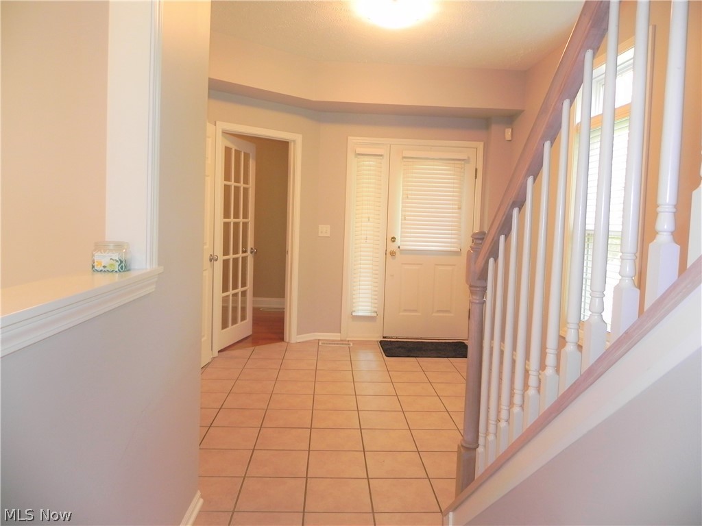 Foyer looking towards front door and first floor den.