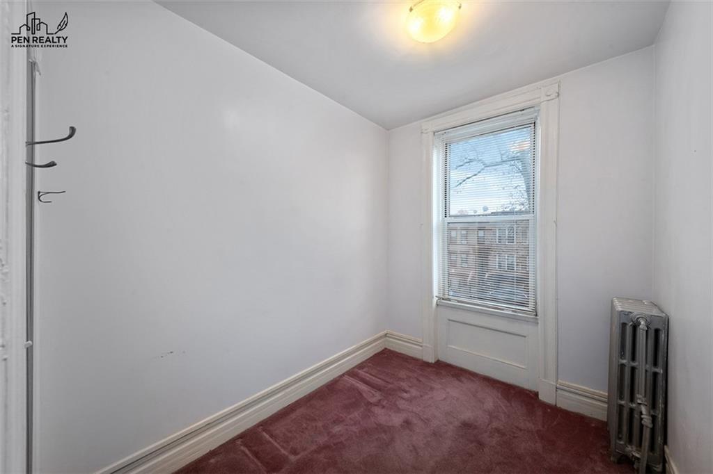 335 Bay Ridge Parkway Brooklyn, NY 11209 - Photo 12 of 15 an empty room with windows