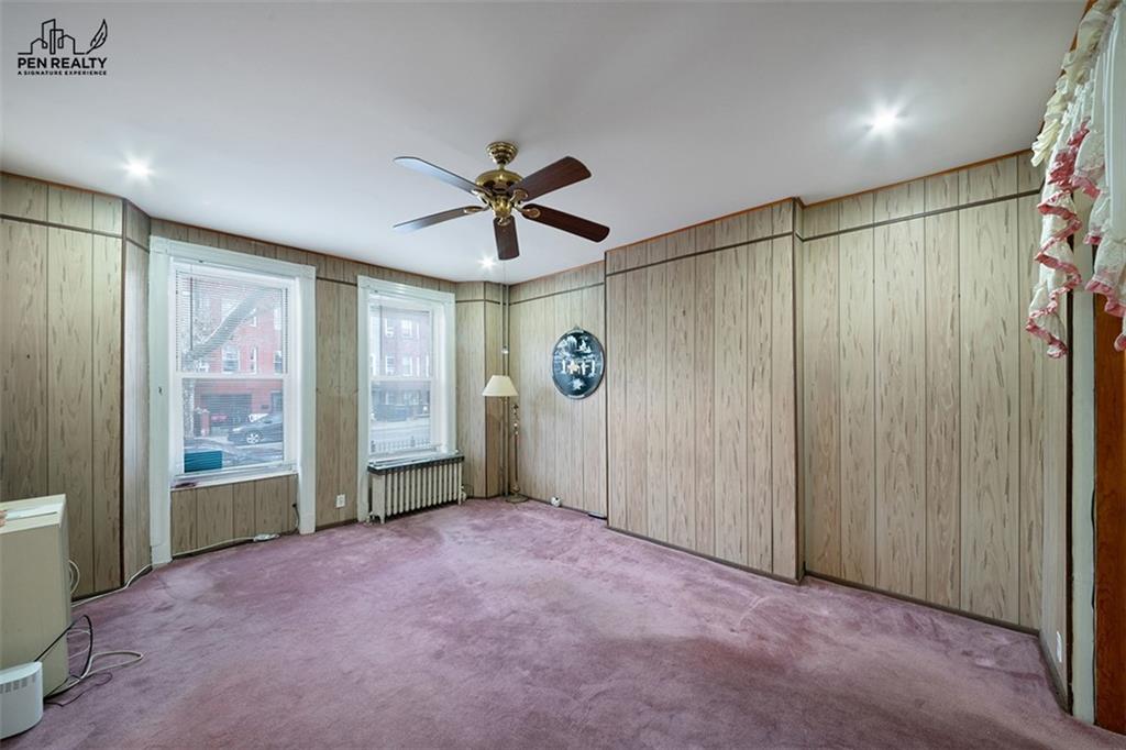 335 Bay Ridge Parkway Brooklyn, NY 11209 - Photo 3 of 15 a view of a big room with windows and cabinet
