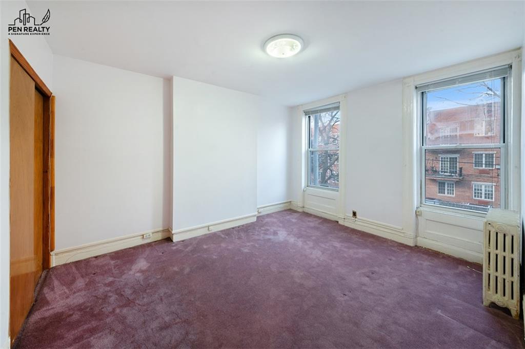 335 Bay Ridge Parkway Brooklyn, NY 11209 - Photo 9 of 15 an empty room with windows