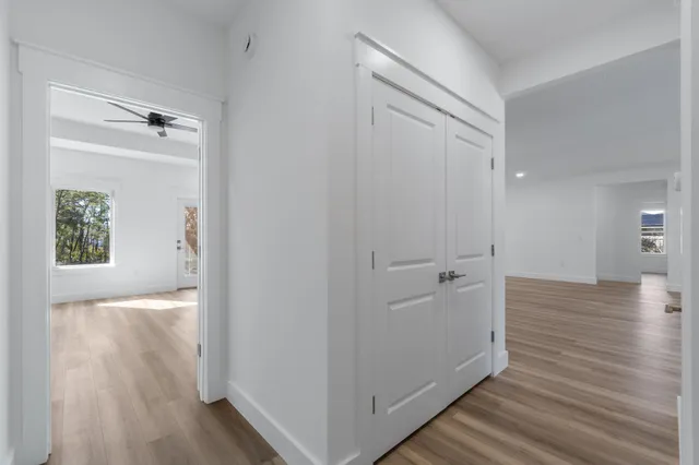 a bathroom with a sink mirror and vanity