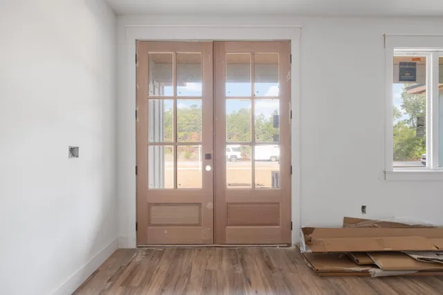 a kitchen with a cabinets and wooden floor