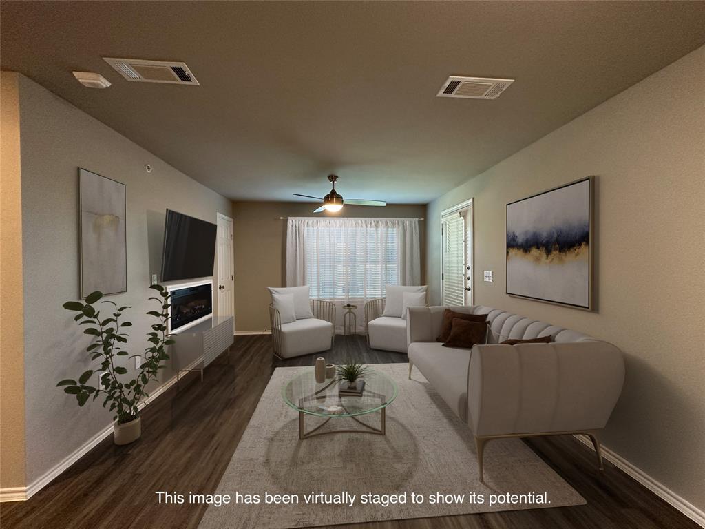 a living room with furniture wooden floor and a flat screen tv
