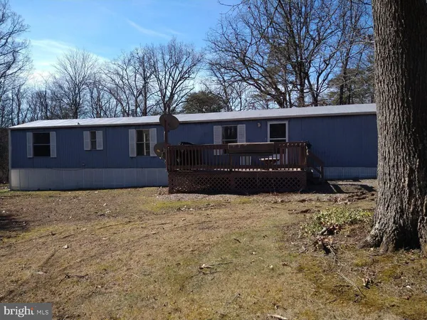 a house with trees in front of it